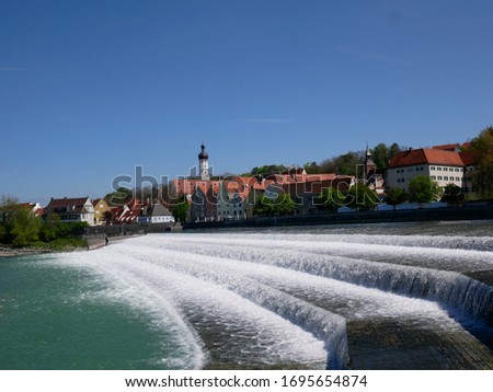 Landsberg am Lech in Bavaria cascade water and city panorama in sunny summer day