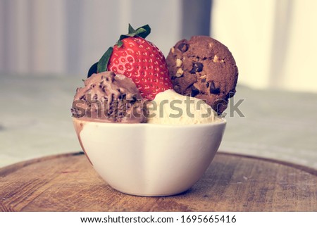 Icecream and strawberry in a macro vision