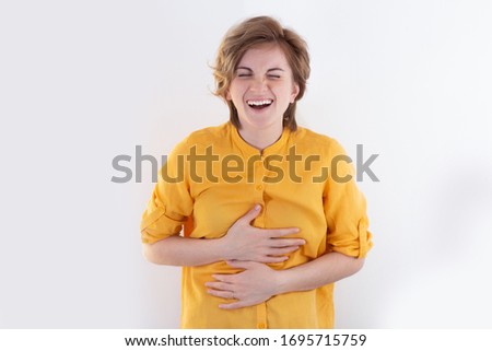 I can't stop laughing! You look so funny! Close-up photo portrait of an attractive quirky funny lady isolated on a white background. The concept of positive news, enjoy facial expressions, have fun an
