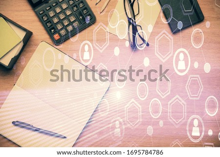 Double exposure of social network theme drawing and work table top veiw. Concept of international connection.