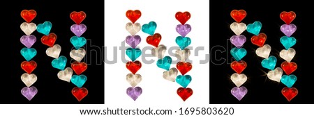 Isolated Font English or Latin Letter N made of colorful glass hearts with sparkles on white and black backgrounds