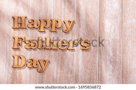 Happy Father's Day text on rustic white wooden background. greeting card concept.