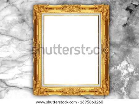 Golden picture frame isolated on marble background