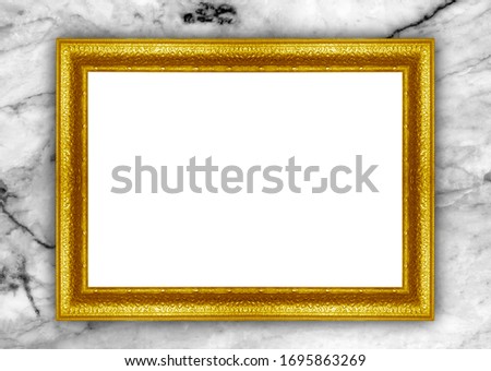 Golden picture frame isolated on marble background