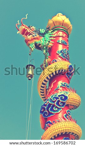 Dragon statue with the blue sky field.