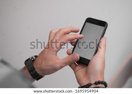 young hands man using a cellphone