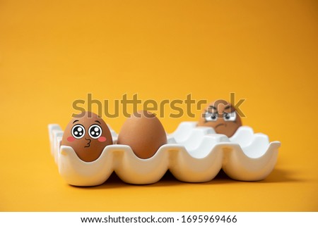 The expression and expression of the eggs in the tray on a yellow background