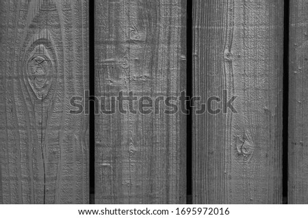 Zinc Toned Picket Fence.  Monochrome closeup of a redwood plank fence for use as an ad or portrait backdrop.