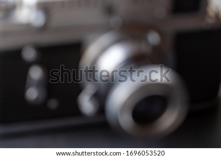 Defocused image of an old camera. Close-up.