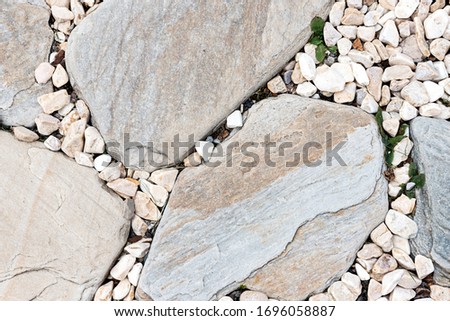 Stone path background above.  Close up Wallpaper. Many stones. Stones small and large
