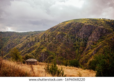 Traditional bulgarian stone house at the autumn mountain