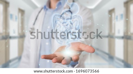 Gastroenterologist on blurred background using digital x-ray of human intestine holographic scan projection 3D rendering Royalty-Free Stock Photo #1696073566