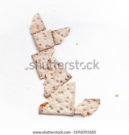 flatbread tangram puzzle in cat shape on white background