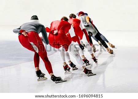 group man athletes skaters warm up during speed skating competition