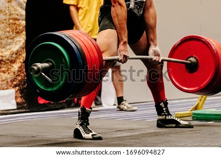 man powerlifter record weight deadlift in powerlifting competition Royalty-Free Stock Photo #1696094827