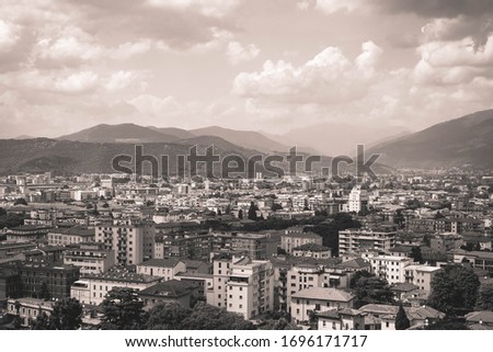 Scenic retro styled view of Brescia cityscape from the historical castle. Lombardia. Italy