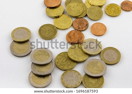 Euro coins on a white background. Macro photo.