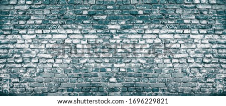 Old shabby dark blue brick wall large texture. Rough navy masonry banner backdrop. Industrial grunge background