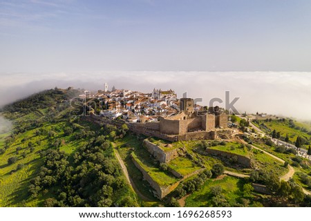 Monsaraz drone aerial view on the clouds in Alentejo, Portugal