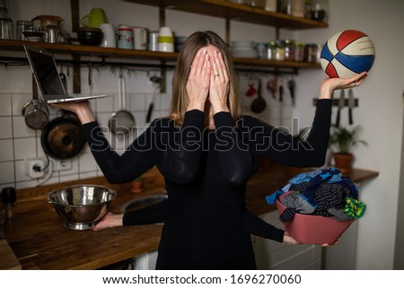 A busy mom doing everything at once. Royalty-Free Stock Photo #1696270060