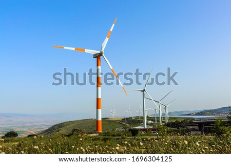 Wind generator - wind farm on Mount Gilboa. Israel. Modern equipment for generating electric energy. The concept of environmental friendliness, environmental protection and tourism photo