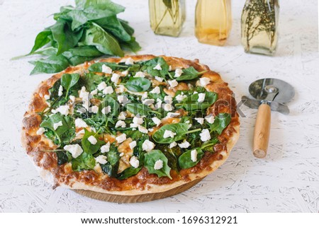Pizza with spinach on a white background. Diet Pizza. Proper nutrition.