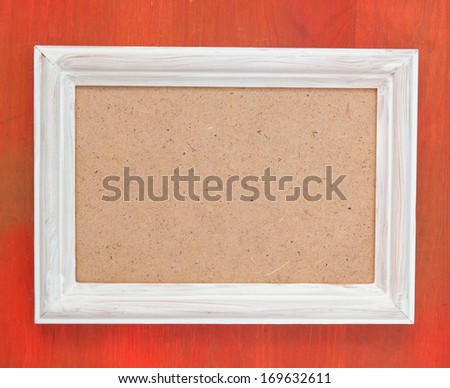 empty picture frame on wooden background