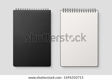 Real photo, spiral bound notepad mockup template with black paper cover, isolated on light grey background. High resolution. Royalty-Free Stock Photo #1696350715