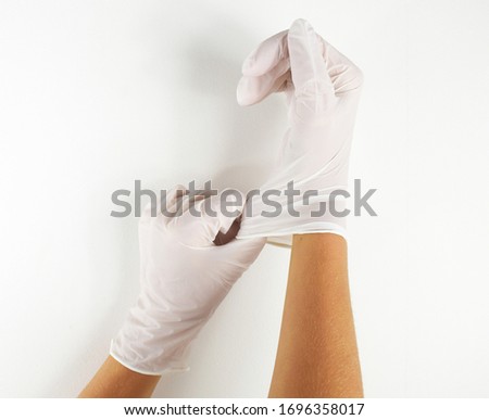 Human hands with plastic gloves