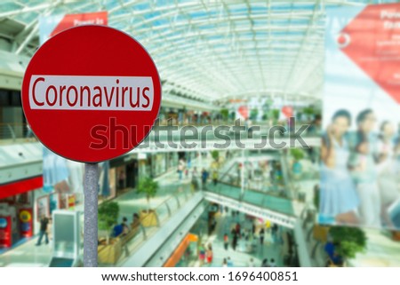 stay at home due to coronavirus concept, cowded shoppinf mall in background