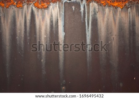 A background element in tones of metallic silver, orange and black.