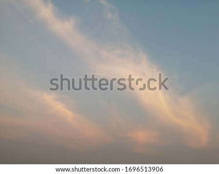 The​ beutiful​ sunset​ twilight​ on​ the​ blue​ sky​ for​ background. Sunset​ sky​ for​ vintage​ background. Dim cloudy​ on​ sunset​ twilight. Golden​ light​ isolated​ colors in rural. 