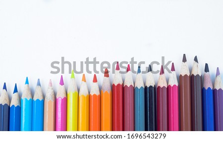 A close-up of colorful crayons isolated on a white background.