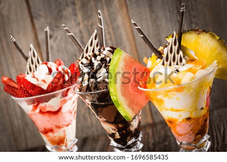 several delicious sundaes with different sorts