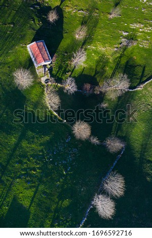 Aerial view of the Miera River Valley, Countryside Landscape with shepherd hut in winter, Pasiegos Valleys, Cantabria Autonomous Community, Spain, Europe