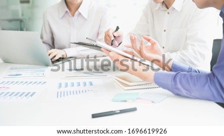 Business man supervising and secretary to execute business plan and consultant analyzing company annual financial report balance sheet statement working with documents graphs. Audit and consultant
 Royalty-Free Stock Photo #1696619926