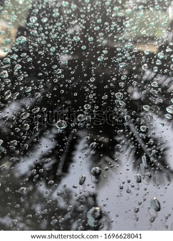 Rain drops on glass of car