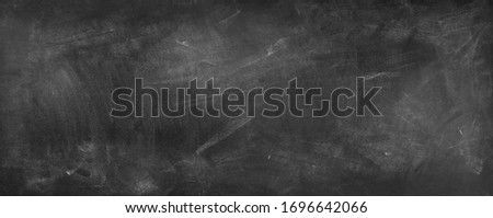 Chalk rubbed out on blackboard background Royalty-Free Stock Photo #1696642066