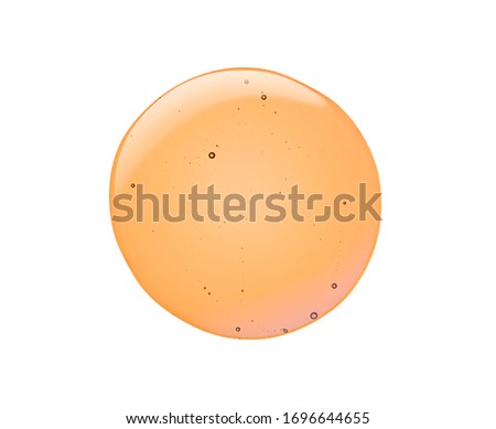 Cream gel oil yellow orange transparent cosmetic sample texture with bubbles isolated on white background