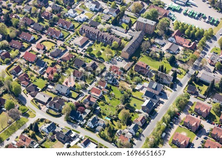 Settlement with houses in a small town, photographed from above Royalty-Free Stock Photo #1696651657