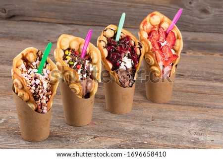 Different types of bubble waffle ice cream to go Royalty-Free Stock Photo #1696658410