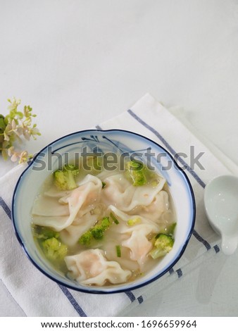 shrimp wonton soup with broccoli on the bowl with tasteful. Type of Chinese dumpling with shrimp stuffing inside. Ingredient : Shallot, garlic, powdered chicken stock, sesame oil, salt, sugar, pepper.