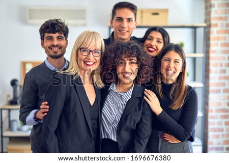 Group of business workers smiling happy and confident. Posing together with smile on face looking at the camera at the office