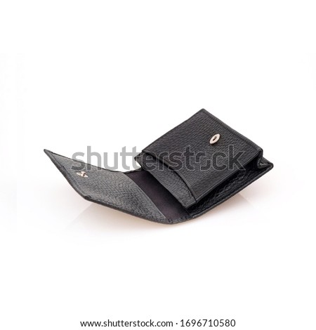 Black leather business card holder isolated on black background