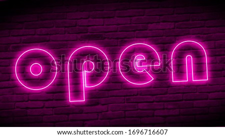 3d neon sign OPEN against a brick wall.