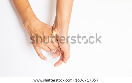 Old hand. Wrinkled skin. Pain of wrist on white background.