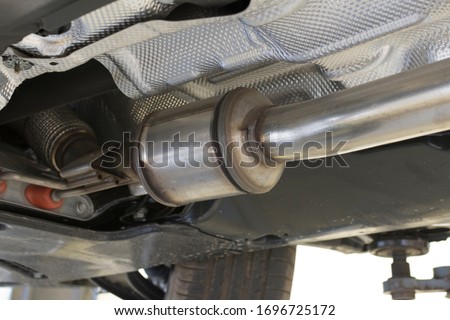 Catalytic converter of a modern car bottom view.	 Royalty-Free Stock Photo #1696725172