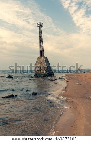 Old lighthouse on the Baltic coast in spring