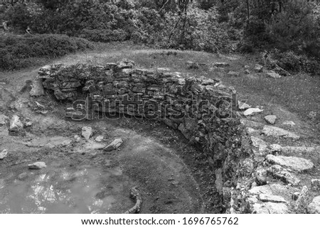 Old style photo of the ruins of an ancient water reservoir on top of a mountain on the Bodrum Peninsula in Turkey