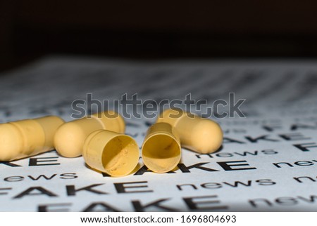 placebo medicine empty yellow capsule Royalty-Free Stock Photo #1696804693